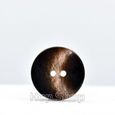 Chocolate glossy plastic button with a moon pattern