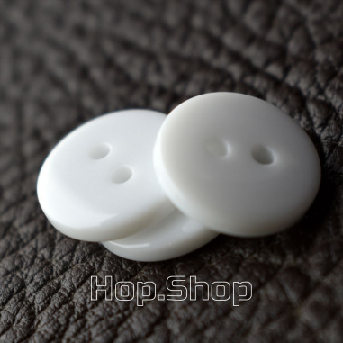 White glossy plastic shirt button